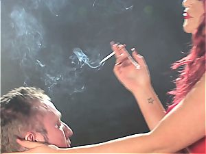 redhead fuckslut predominates a fellow while smoking